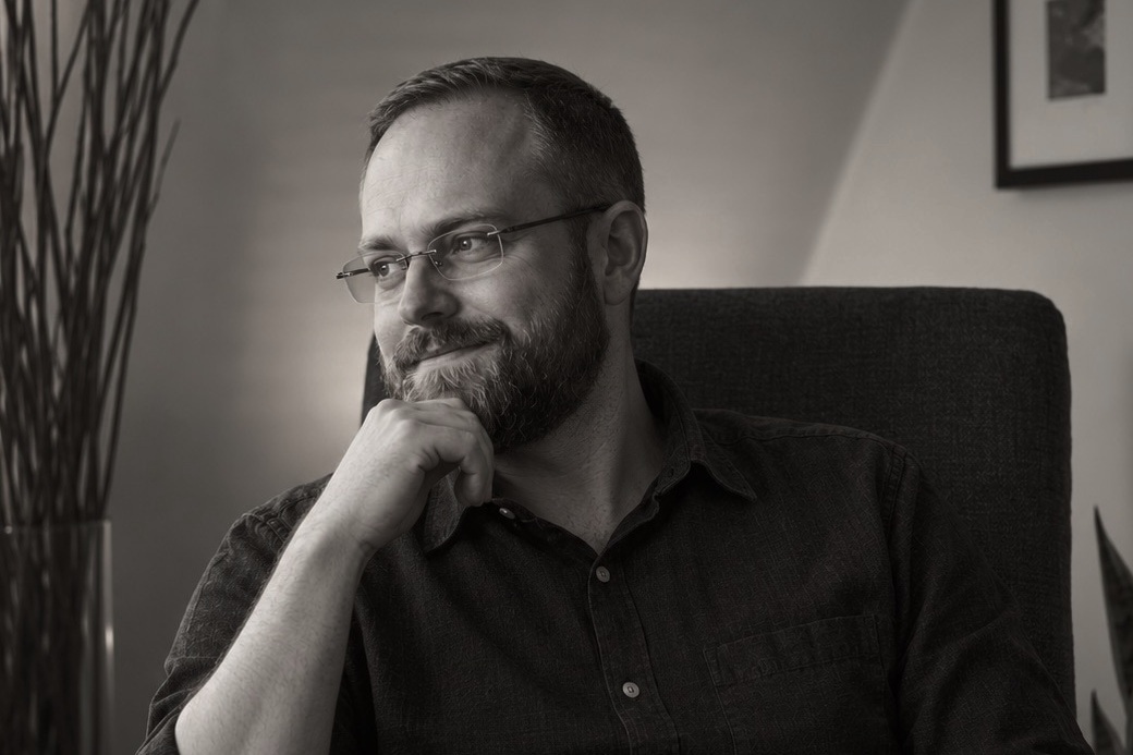 Mike Smukler seated in his home office