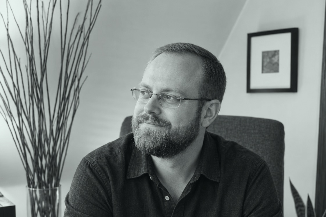 Mike Smukler seated in his home office