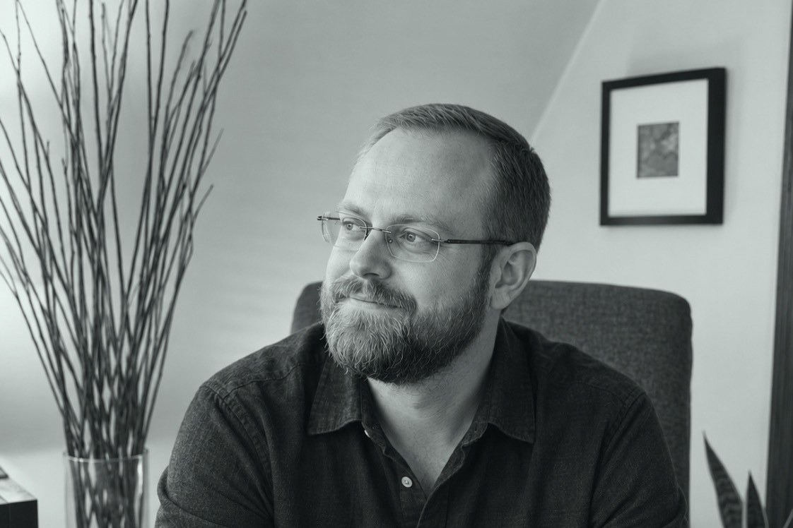Mike Smukler seated in his home office